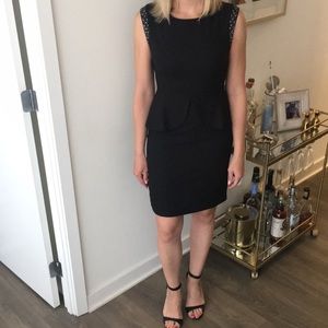 Black cocktail dress with peplum detail